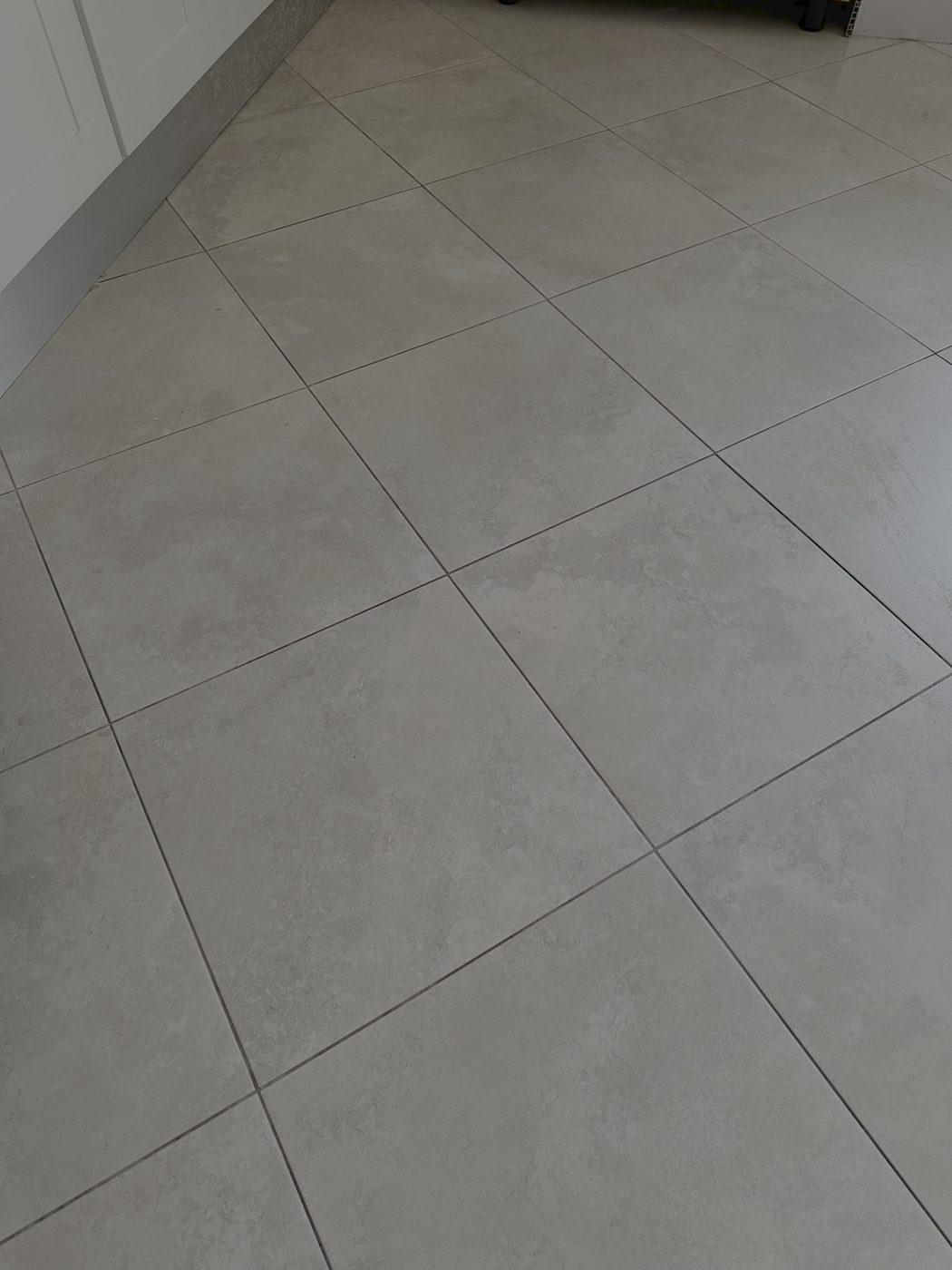 Grey porcelain kitchen floor laid on the diagonal